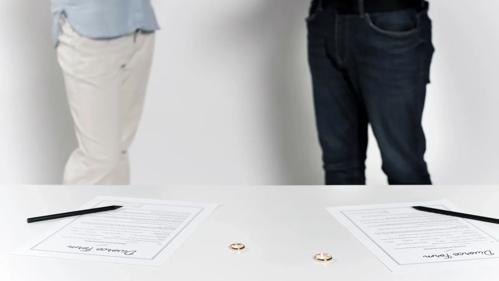 Separating spouses reviewing divorce documents
